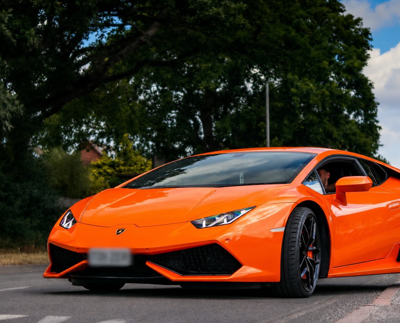 Orange Lamborghini Huracan hire Dorset, front view on road